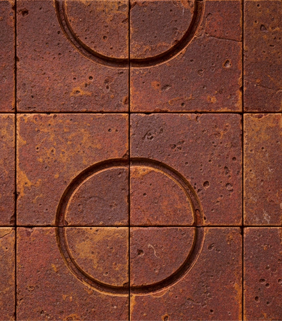 Weathered stone tiles scored with circular grooves — Arca Risk Management