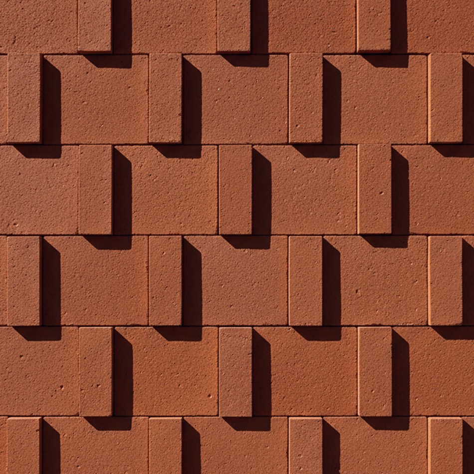 Offset terracotta brickwork casting stepped shadows — Arca Risk Management